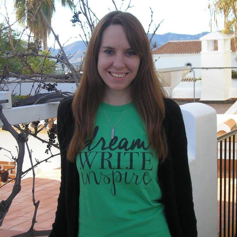 Picture of Elizabeth Olmedo in a green t-shirt that says, Dream, Write, Inspire.